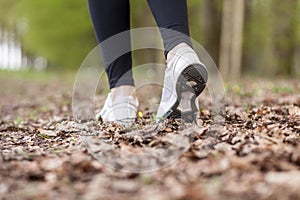 Feet of a running woman