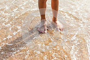 Feet on sand