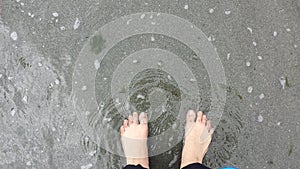 Feet on the sand walking barefoot