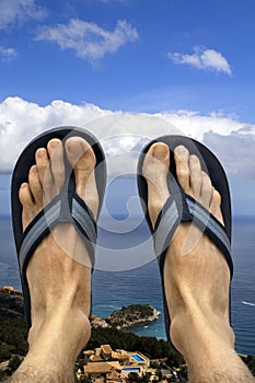 Feet and sandals with a view