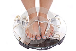 Feet scales tape blue toenails photo