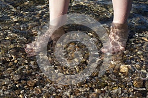 Feet in the sea