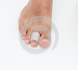 Feet silicone toe protector. Man wearing protector for claw or hammer toes