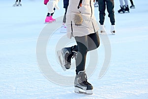 Feet skating girls on skates at the ice arena