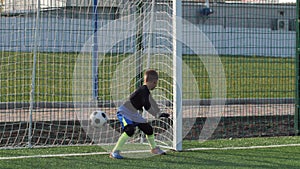 Feet of skilful preteen soccer forward with ball