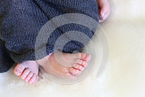 Feet of a sleeping newborn baby close-up