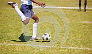 Feet, soccer player and penalty kick on field for goal, competition or game for sports career. Man, football and