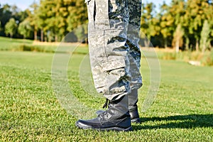 Feet of soldier in military boots.