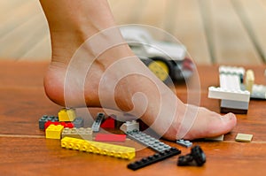 A feet standing up on Legos of various colors