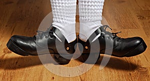 Feet in step shoes and white socks