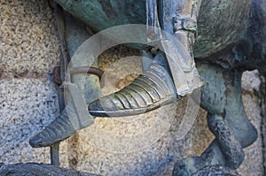 Feet in stirrup of Saint George