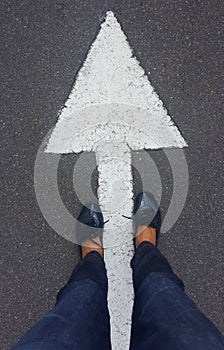 Feet on tarmac road