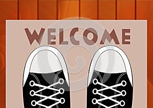 Feet teen in sneakers close up on a doorway rug that says Welcome in front of the house.