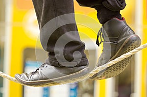 The feet of a tightrope walker