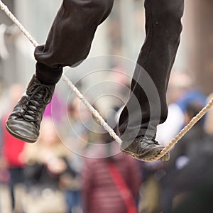 The feet of a tightrope walker