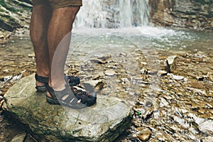 Feet Of Traveler On Stone On Waterfall Background Hiking Journey Travel Trek Concept