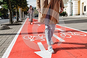 feet walking along bike lane or road for bicycles