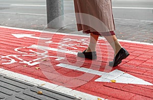 feet walking along bike lane or road for bicycles