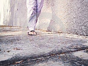 Feet walking on the concrete floor