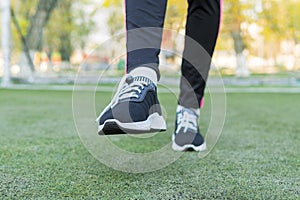 Feet walking through the grass