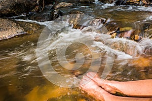 Feet in waterfall, slow shutter speed