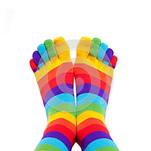 Feet wearing winter colorful striped socks