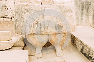 Feet of a woman, fragment of a huge statue of the mother goddess in Tarxien temple in Malta photo