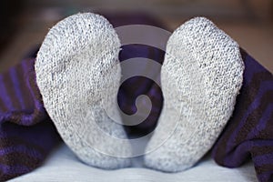 Feet in woolen socks