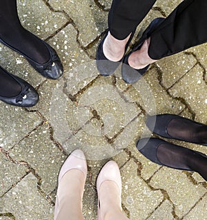 Feet of young girls standing together