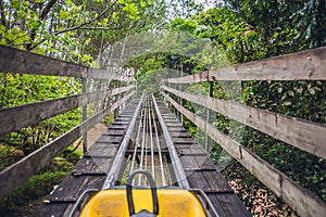 Feet of a young woman on Alpine Coaster