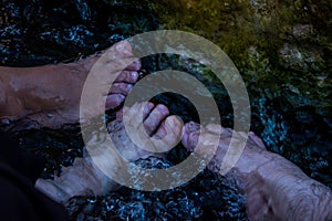 Feett in the small waterpool with thermal water