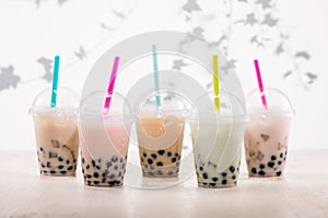Fefreshing iced milky bubble tea with tapioca pearls in plastic