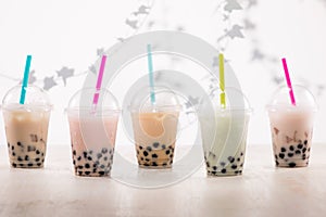 Fefreshing iced milky bubble tea with tapioca pearls in plastic