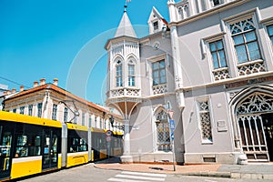 Fekete haz museum and modern tram in Szeged, Hungary