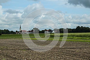 Feldmoching church with wheat field in the foreground photo