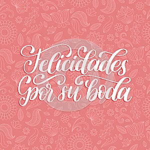 Felicidades Por Su Boda translated from Spanish handwritten phrase Congratulations For Your Wedding on pink background. photo