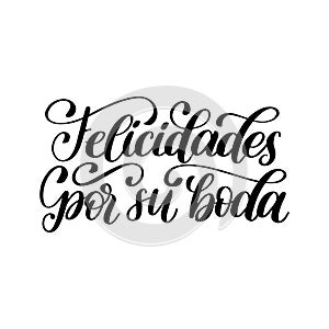 Felicidades Por Su Boda translated from Spanish handwritten phrase Congratulations For Your Wedding on white background. photo