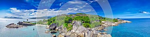 Felicite Island, close to La Digue, Seychelles. Aerial view of tropical coastline on a sunny day