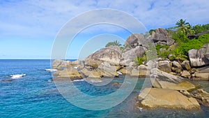 Felicite Island, close to La Digue, Seychelles. Aerial view of tropical coastline on a sunny day