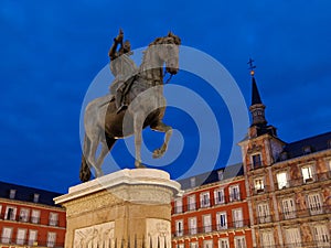 Felipe III Statue in plaza mayor in Madrid at dawn or twilight perspective view photo