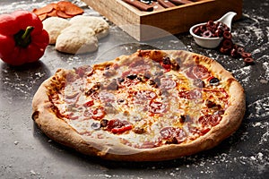Felix Special Pizza isolated on dark background with raw food top view of italian fastfood appetizer