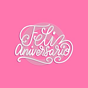 Feliz Aniversario translated from Spanish handwritten phrase Happy Anniversary on pink background.Vector illustration. photo