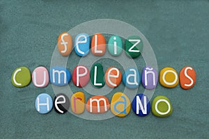 Feliz cumpleanos hermano, spanish happy birthday brother with multi colored stone letters photo