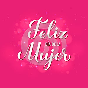 Feliz Dia de la Mujer - Happy Womens Day in Spanish. Calligraphy hand lettering on hot pink background with bokeh photo