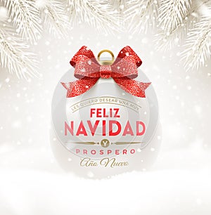 Feliz navidad - Christmas greetings in Spanish. Christmas white bauble with glitter red bow ribbon and type design.