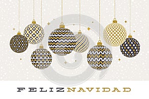 Feliz navidad - Christmas greetings in Spanish - patterned golden baubles on a white background. photo