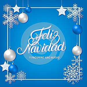 Feliz Navidad hand written lettering with silver decoration ornament.