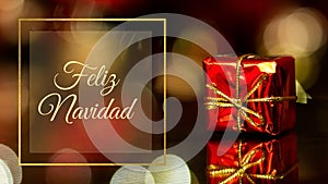 Feliz Navidad - red Christmas gift on the background of lights, christmas time