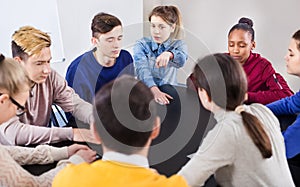 Fellow students playing Mafia game at recess