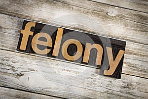 Felony Letterpress Word on Wooden Background